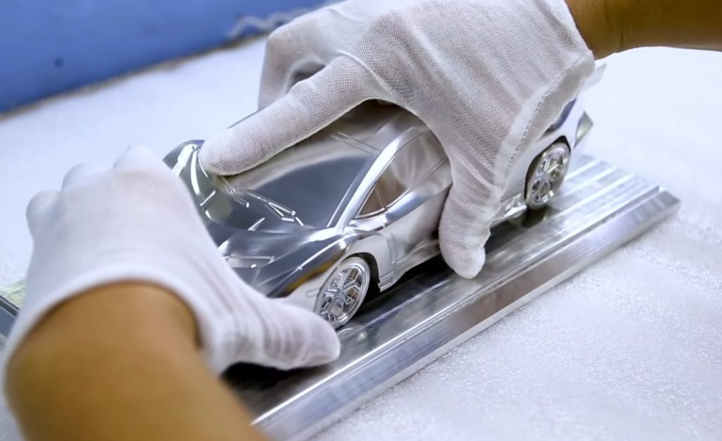 What are the steps in making a diecast model car?